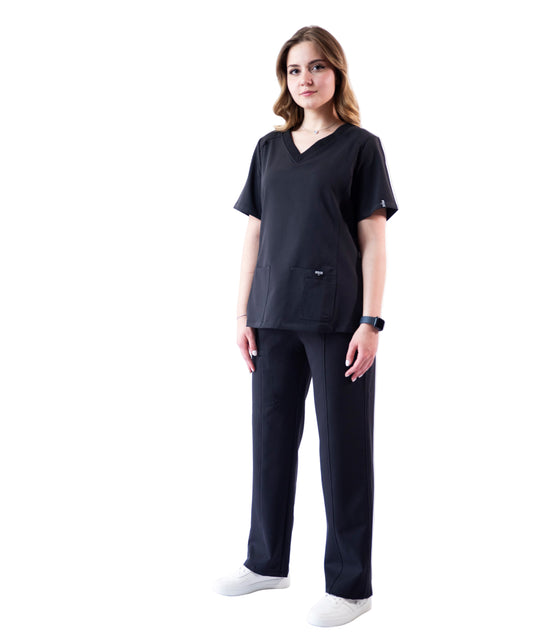 Person wearing a black outfit on a white background