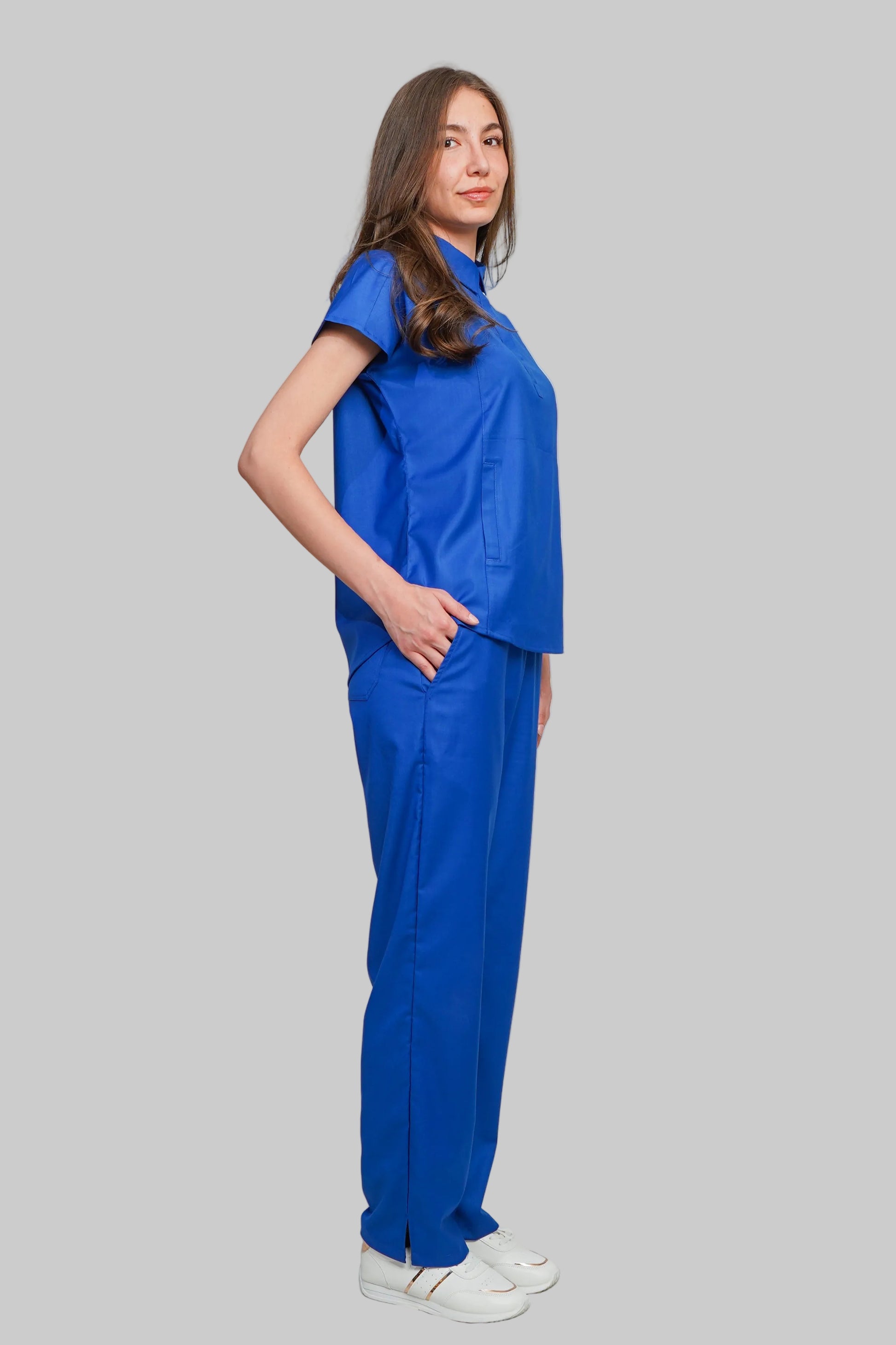 Person wearing a blue outfit on a plain background