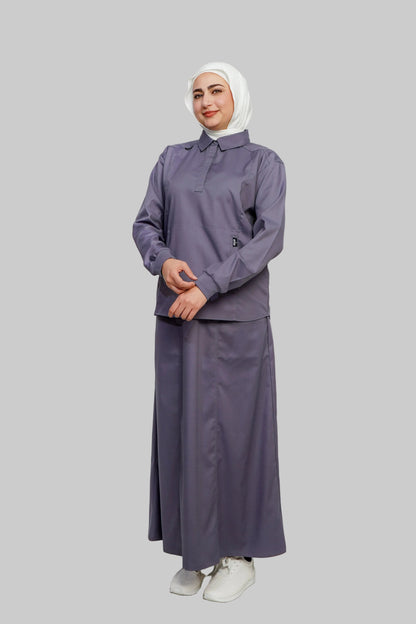 Woman wearing a gray outfit with a hijab on a white background