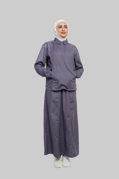 Person wearing a matching purple outfit with a hijab on a white background