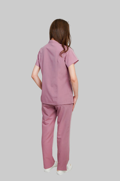 Person wearing a pink outfit on a white background